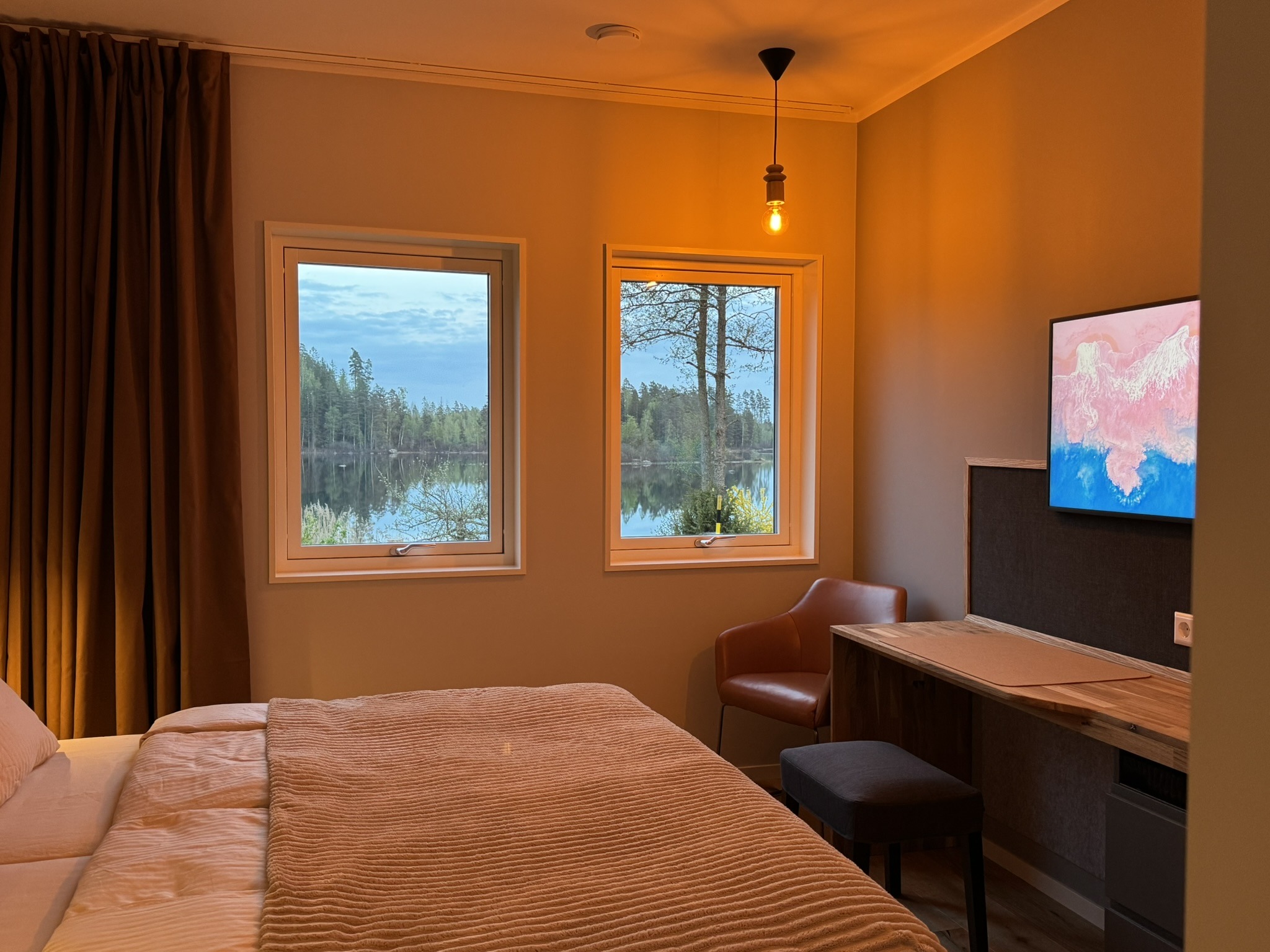 Bedroom with a lake view and desk