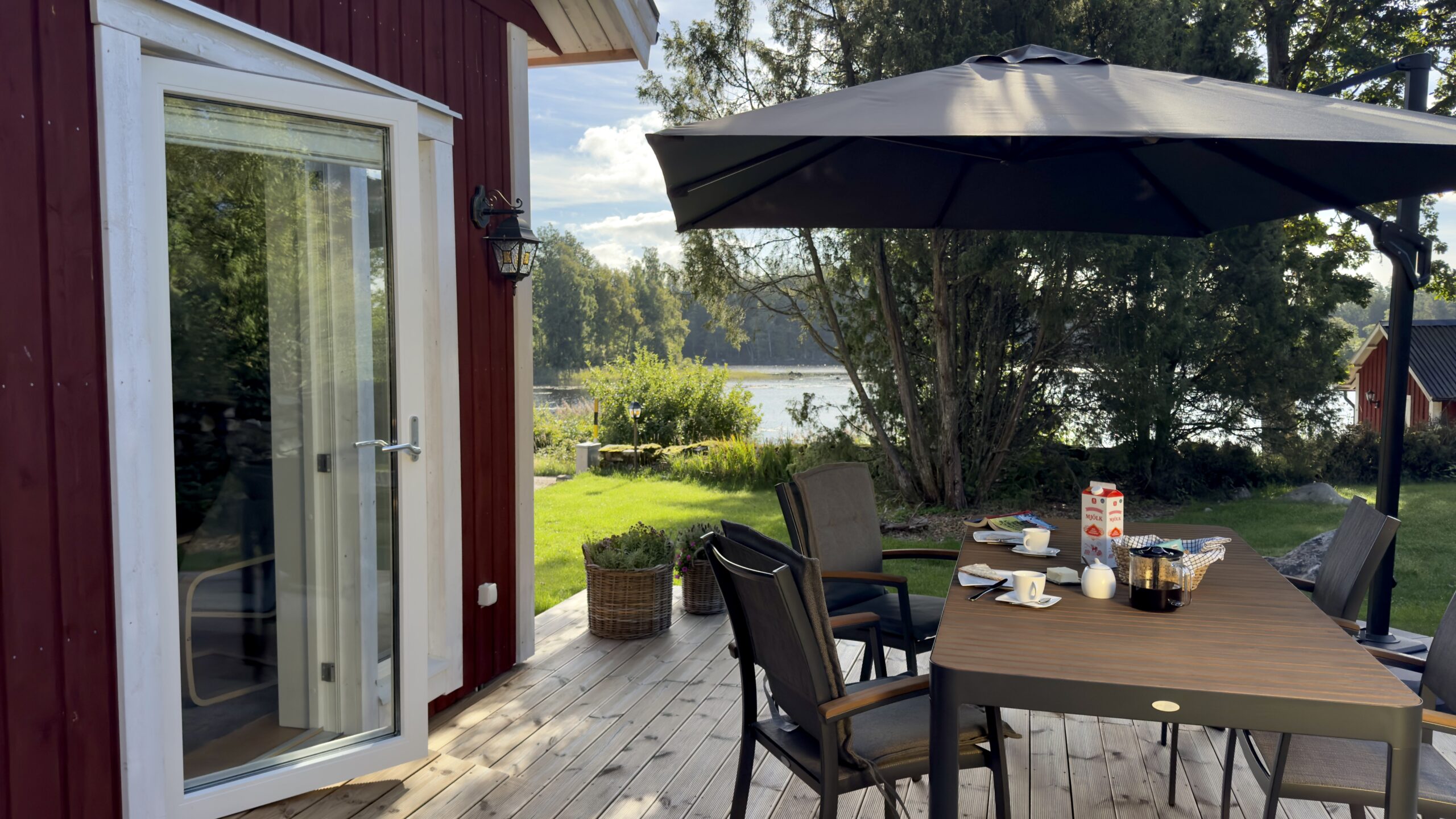 Terrace with a parasol and lake view